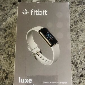 Open box Fitbit luxe fitness and wellness tracker, lunar white band & soft gold